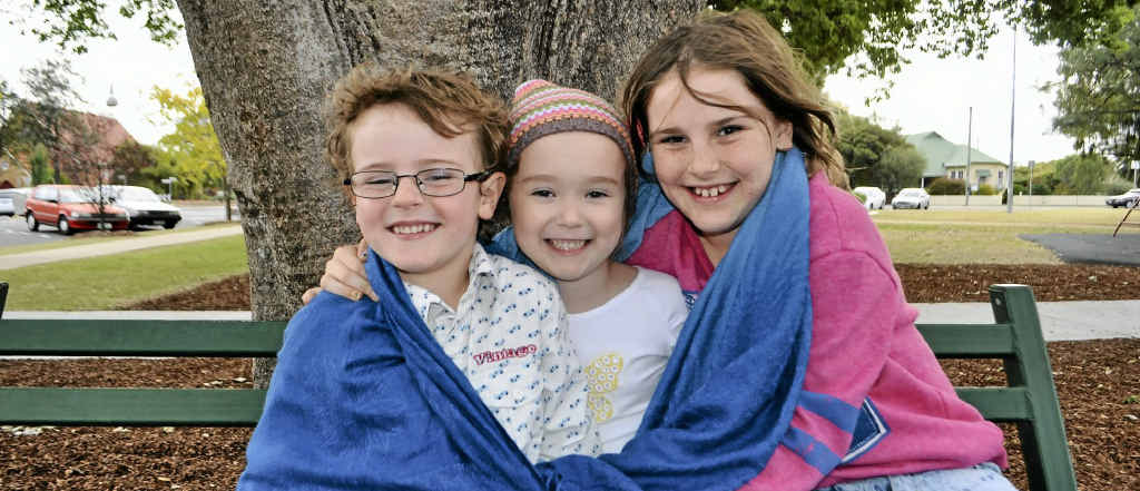 Carter McLaren, Isabella Fletcher and Amelia McLaren stay warm at the park. Carter McLaren, Isabella Fletcher and Amelia McLaren stay warm at the park.